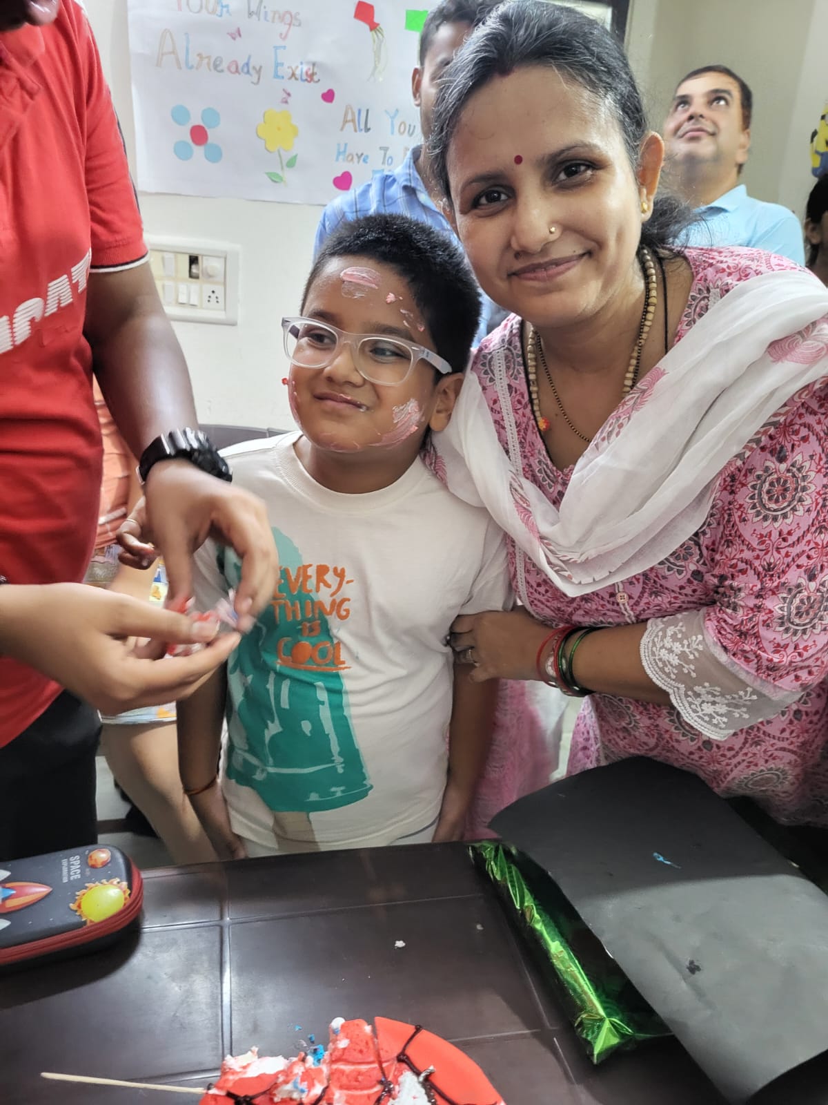 Three children engaged in a learning activity